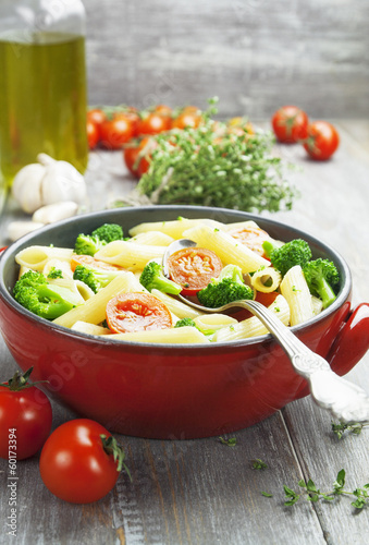 Penne pasta with broccoli and cherry tomatoes
