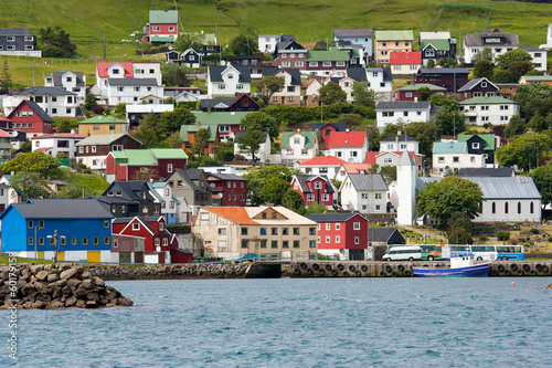 Small nordic village on the sea with colorful buildings photo