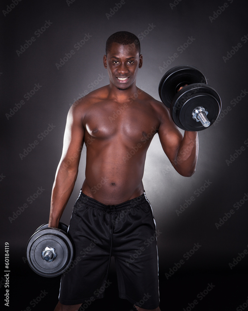 Man Working Out With Dumbbells
