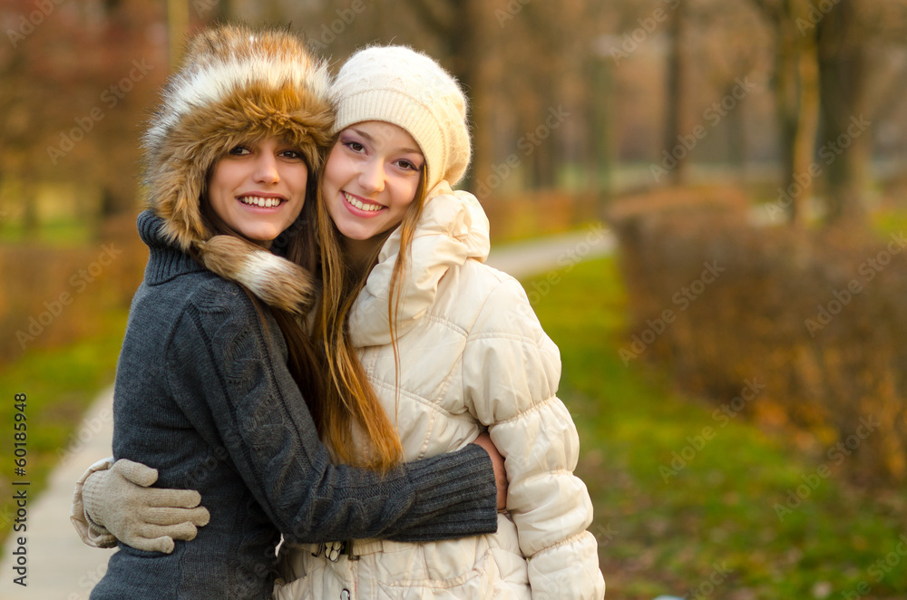 Fototapeta premium Two beautiful girls having fun outdoor