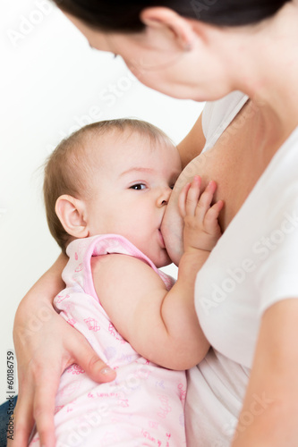 mother breast feeding her kid