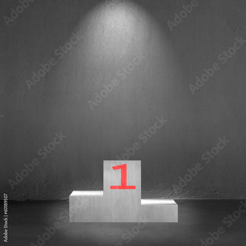 Concrete podium with number 1 on it and spot light