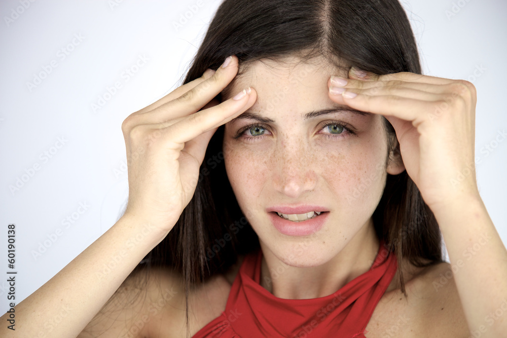 Woman suffering strong migraine in the morning with no makeup Woman suffering strong migraine in the morning with no makeup