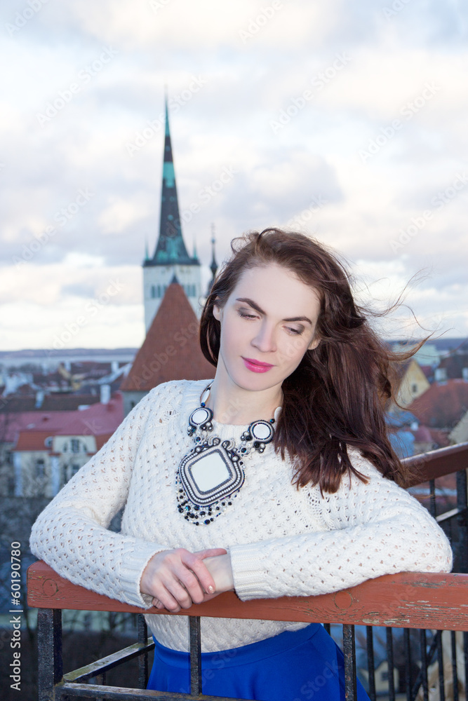 dreaming woman looking down at the city of Tallinn