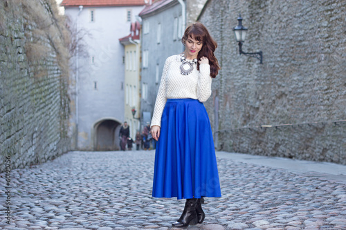 young beautiful woman walking in old town of Tallinn