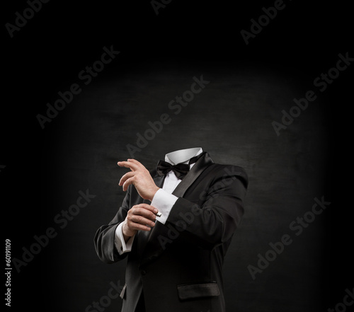 Obraz na plátně Man without head on dark concrete background