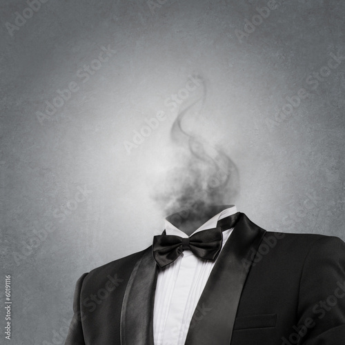 Overworked burnout business man standing headless with smoke ins photo
