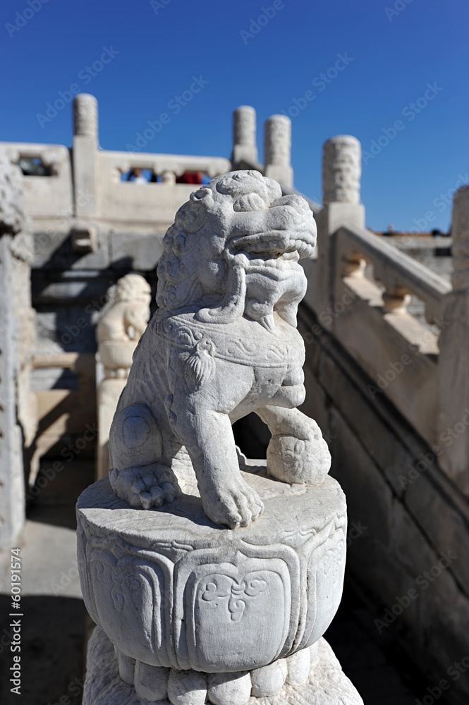a marble figure of a lion in the forbidden city in Beijing, Chin