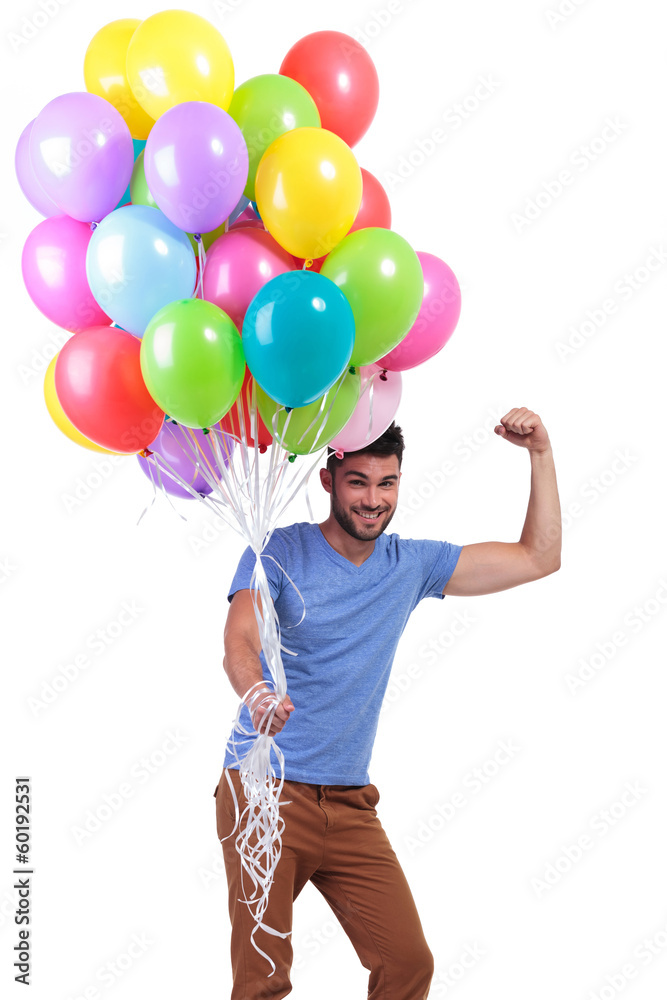 happy casual man winning a big bunch of balloons happy casual man winning a big bunch of balloons
