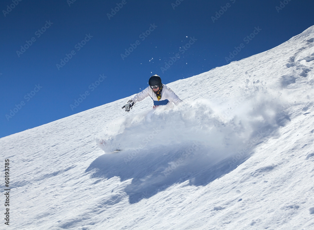 Snowboarder moving down Snowboarder moving down