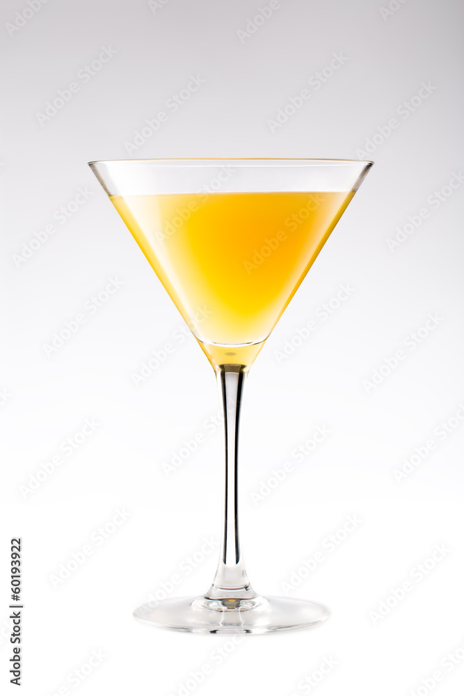 Orange cocktail in a martini glass isolated on white Orange cocktail in a martini glass isolated on white