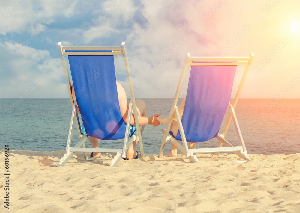 Couple enjoying summer vacation on the beach Couple enjoying summer vacation on the beach