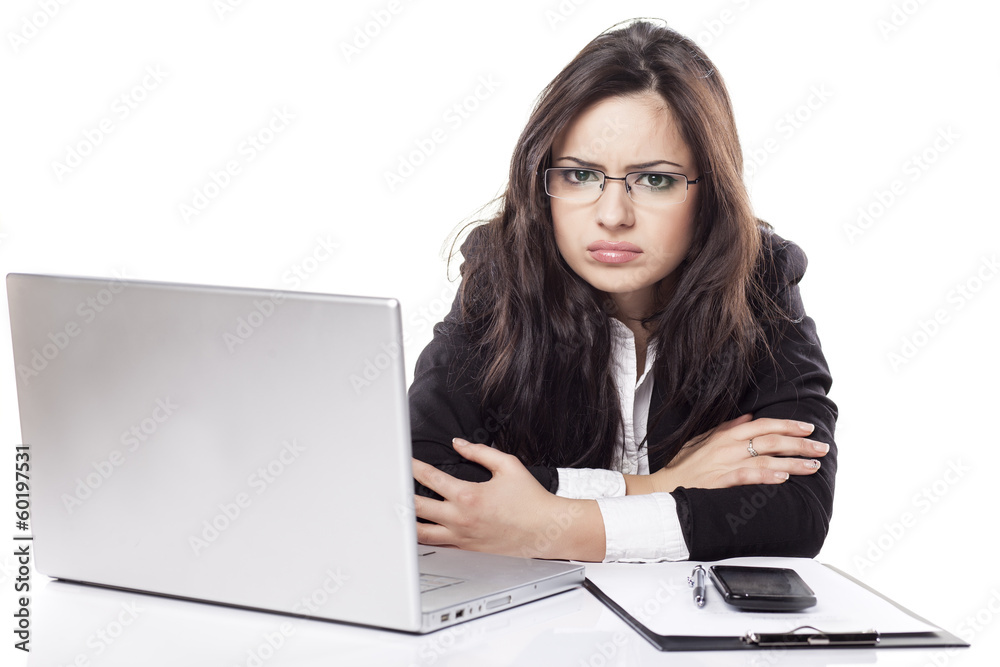 nervous and sad young business woman at the desk with a laptop nervous and sad young business woman at the desk with a laptop