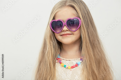  Little model with sunglasses .