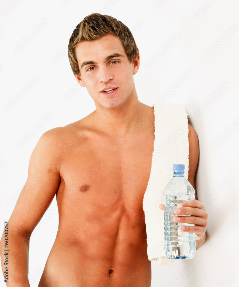 Healthy young man with towel and water Healthy young man with towel and water