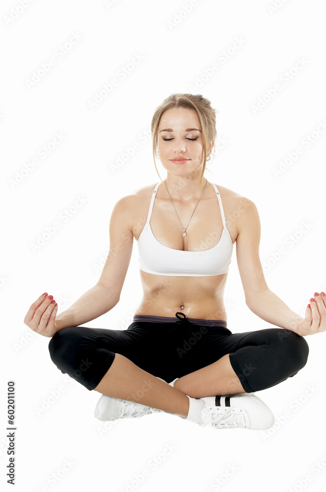 Woman meditating in a yoga pose over white background