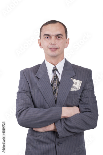 Young businessman in a suit and with dollars in his pocket.