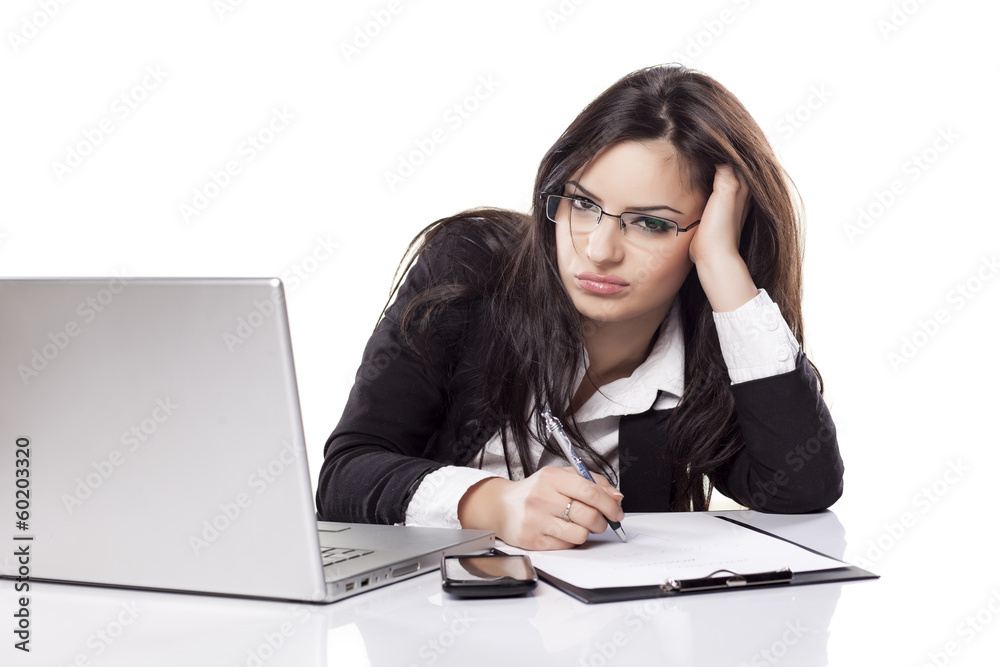 tired and sleepy young business woman at the desk with a laptop tired and sleepy young business woman at the desk with a laptop