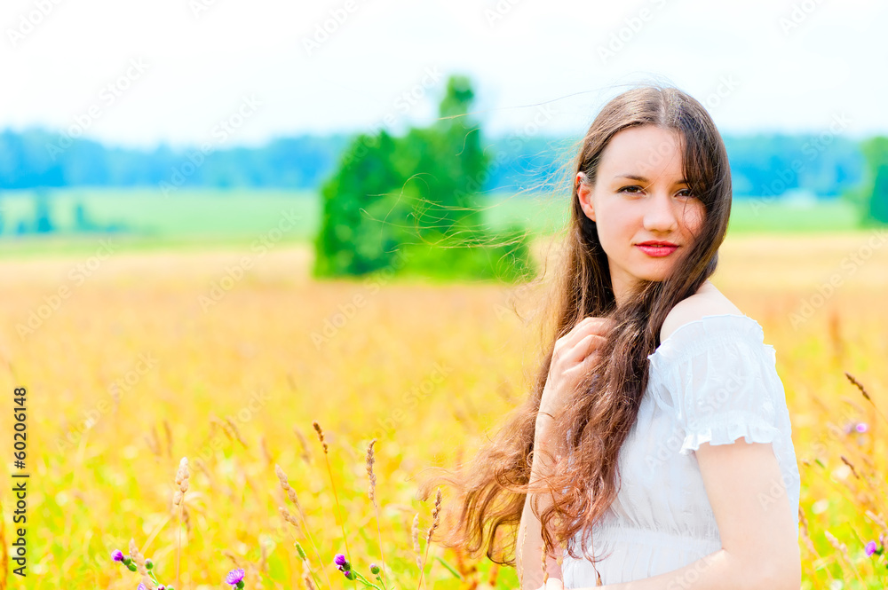 cute girl resting in a field with flowers cute girl resting in a field with flowers