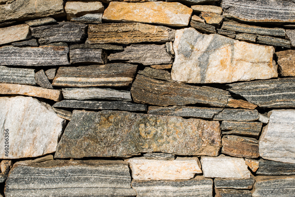 Wall built of stones. Sun light Wall built of stones. Sun light