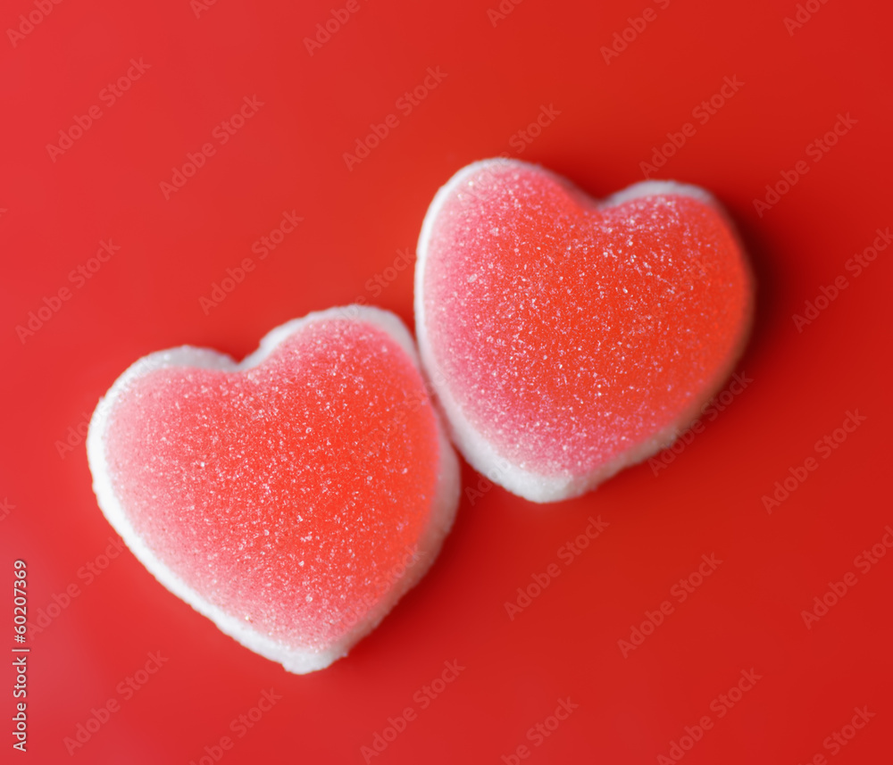 Fototapeta premium Sugar hearts on red background
