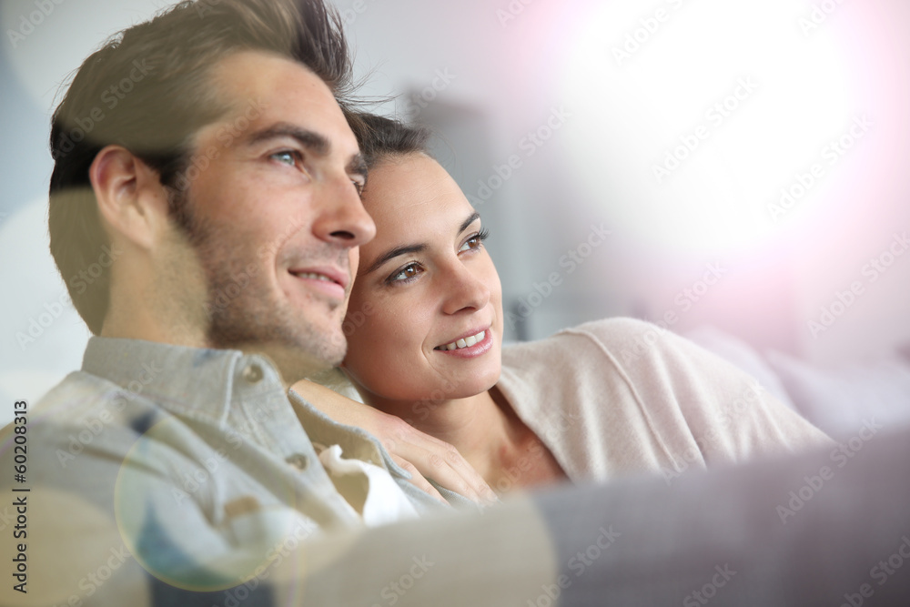 Couple at home relaxing in sofa Couple at home relaxing in sofa