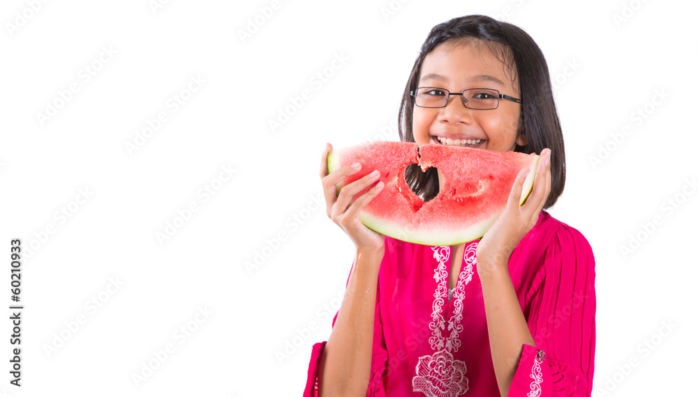 Young asian girl with a heart shape cut out watermelon Young asian girl with a heart shape cut out watermelon