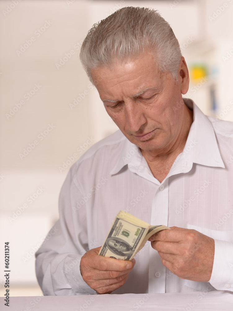 Senior man with dollars Senior man with dollars