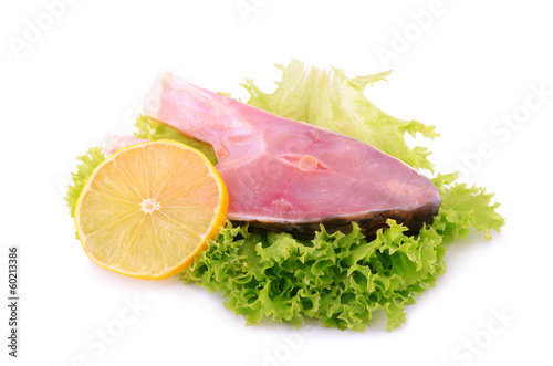 Piece of carp with lemon isolated on white