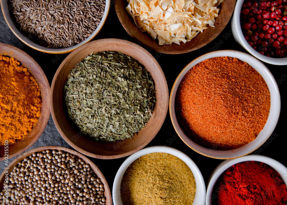 Assorted spices on stone background