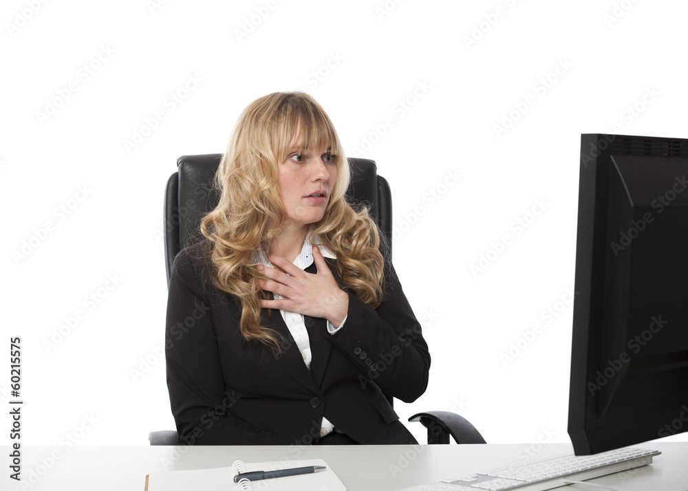 Shocked businesswoman reading her monitor Shocked businesswoman reading her monitor