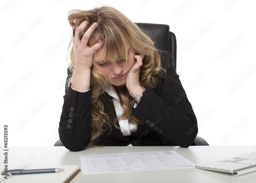 Female business executive studying a report Female business executive studying a report