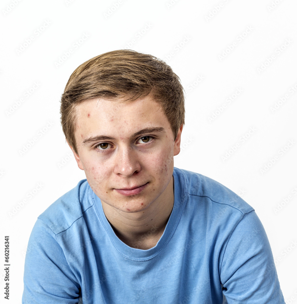 boy with blue shirt posing in studio