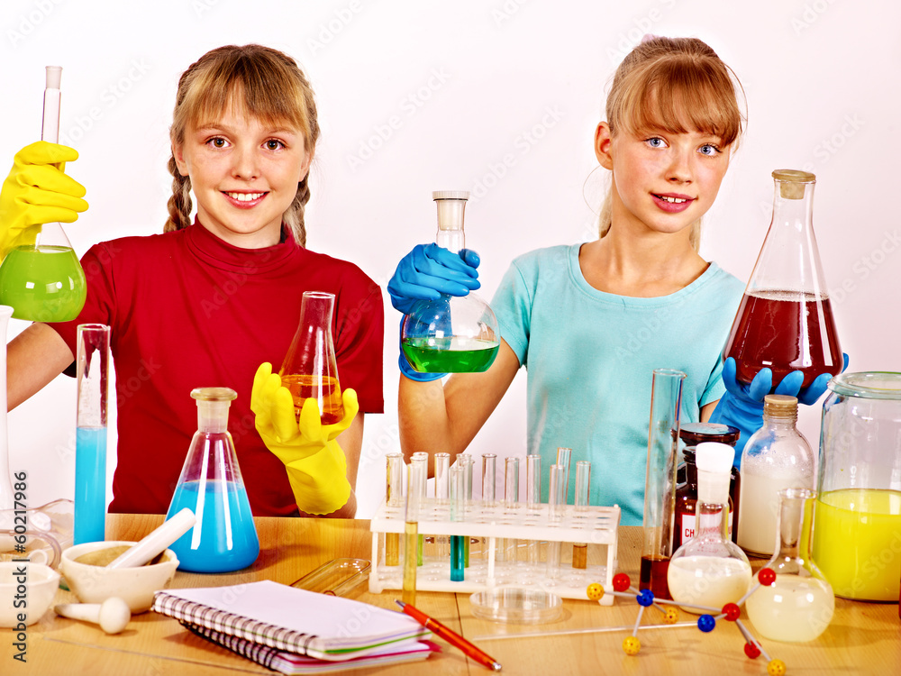 Child in chemistry class. Child in chemistry class.