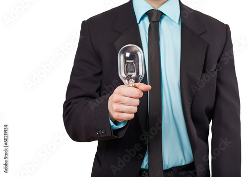 Business man holding light bulb