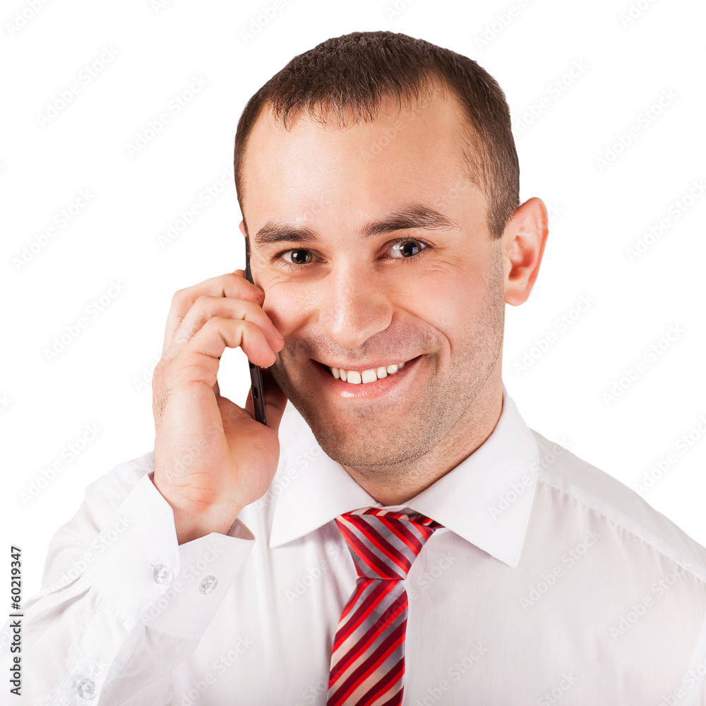 Closeup of happy young man using mobile phone