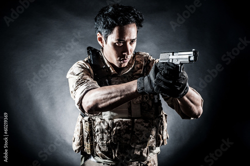 soldier man hold gun fashion