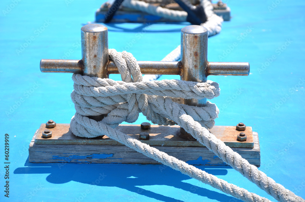 Naklejka premium bollard with rope on deck of yacht