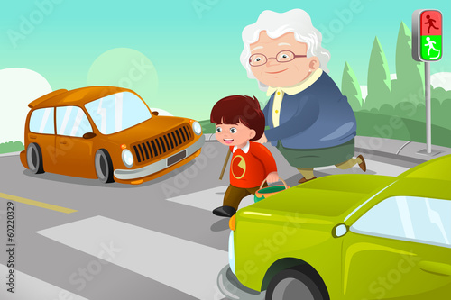 Kid helping senior lady crossing the street