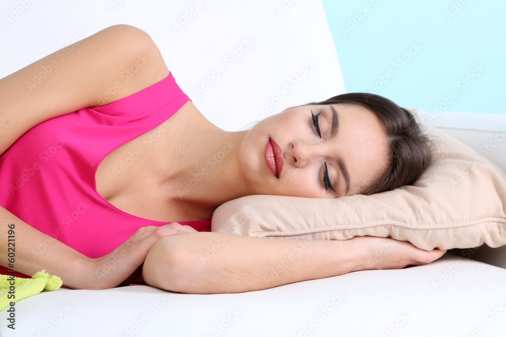 Beautiful young woman sleeping on sofa close up Beautiful young woman sleeping on sofa close up