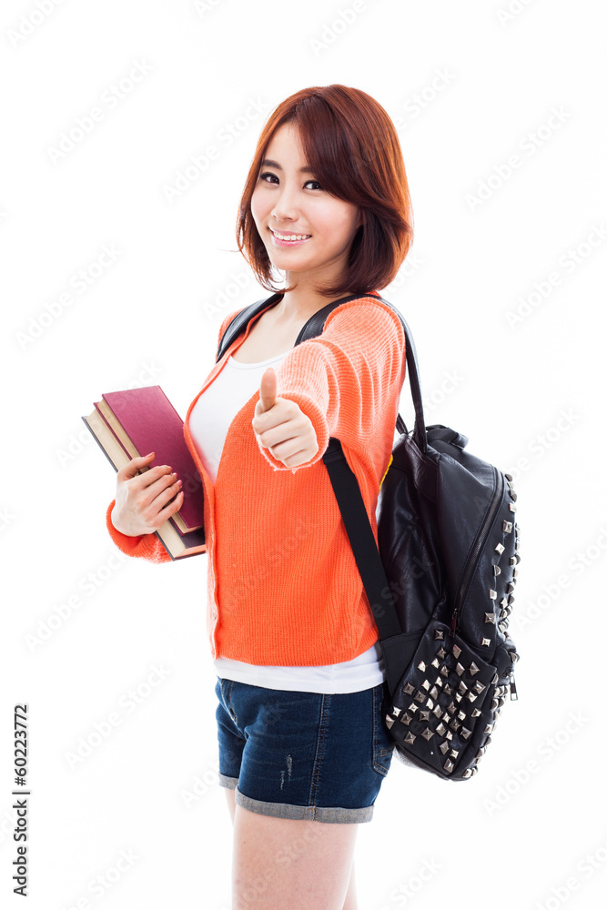 Young happy Asian student show thumb.