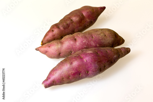 Sweet potatoes on white background.