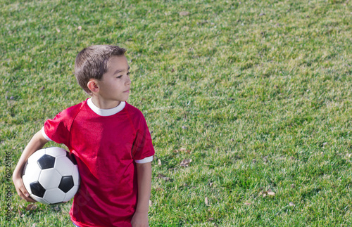 Young Hispanic Soccer Player on Grass field