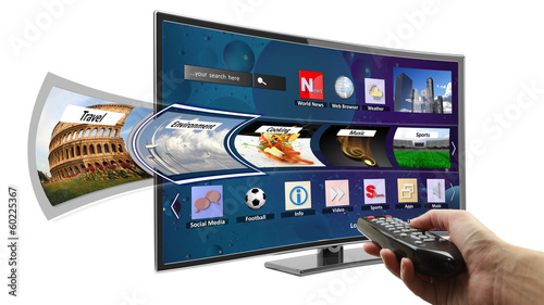 Smart tv with apps and hand holding remote control photo