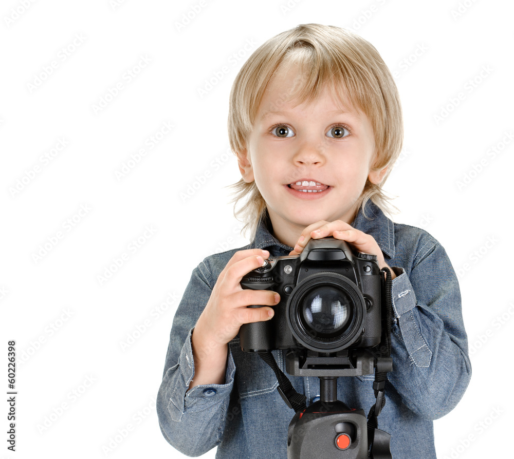little boy with camera on tripod on white background