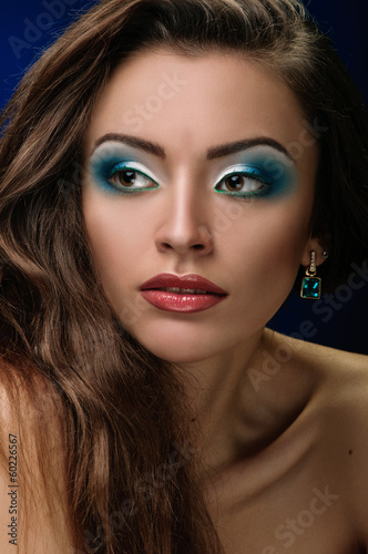 Fototapeta Naklejka Na Ścianę i Meble -  face of young woman with makeup close
