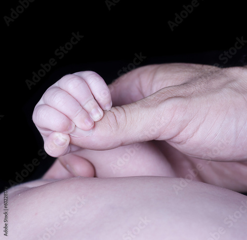 caucasian infant tiny feet photo