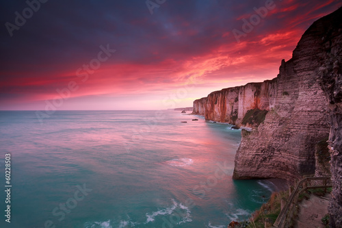 dramatic sunrise over ocean and cliffs