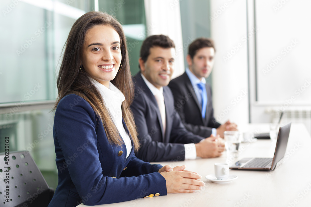 Business team smiling at the office, lined up Business team smiling at the office, lined up