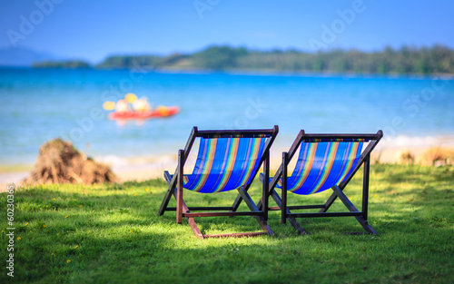 Chairs on beach at tropical island